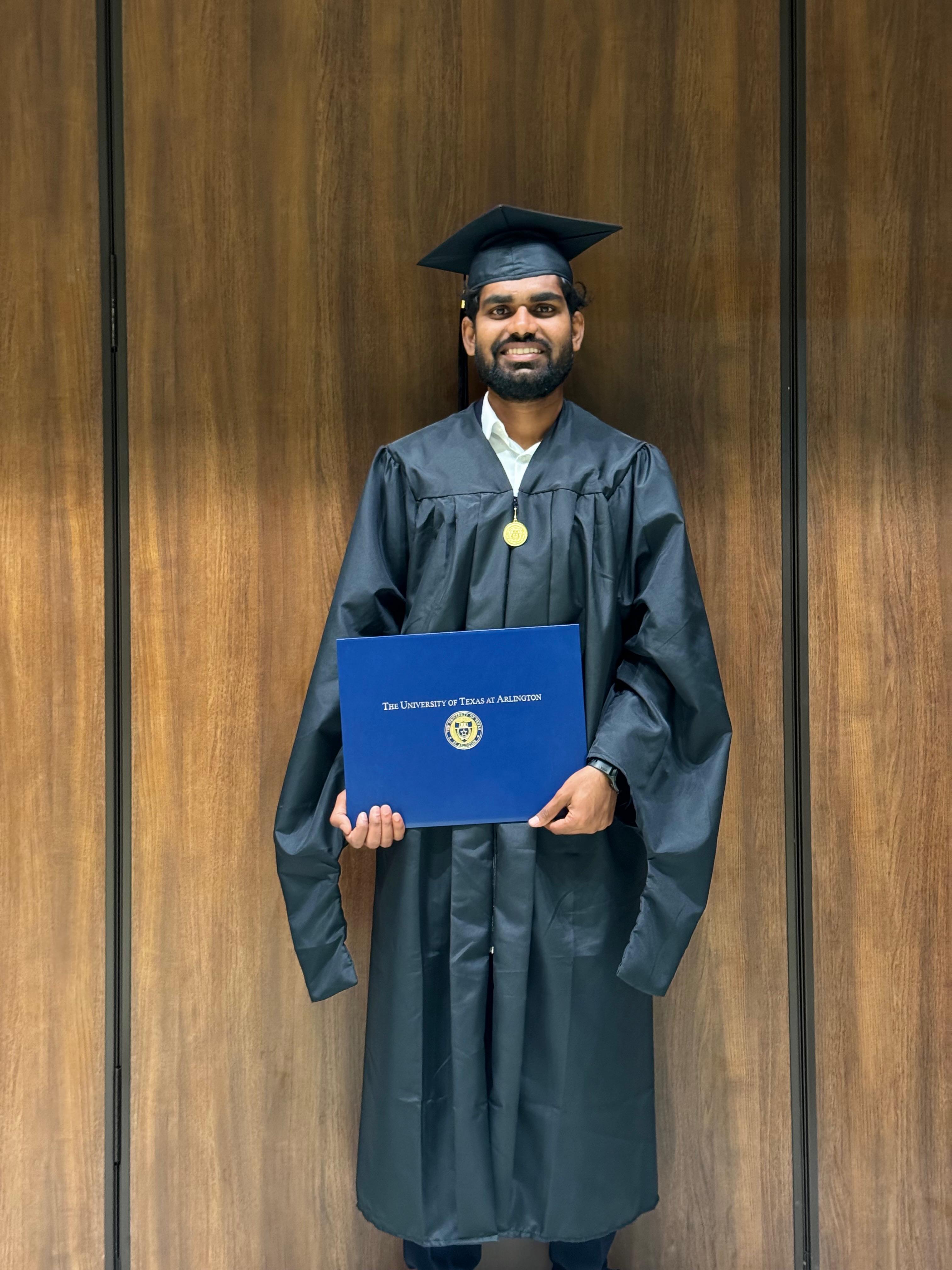 Manoj Pasunoori at UTA graduation ceremony